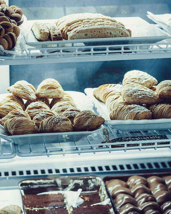 An array of Italian pastries situated in a display case