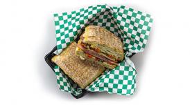 A basket with two slices of a toasted Eataliano panini